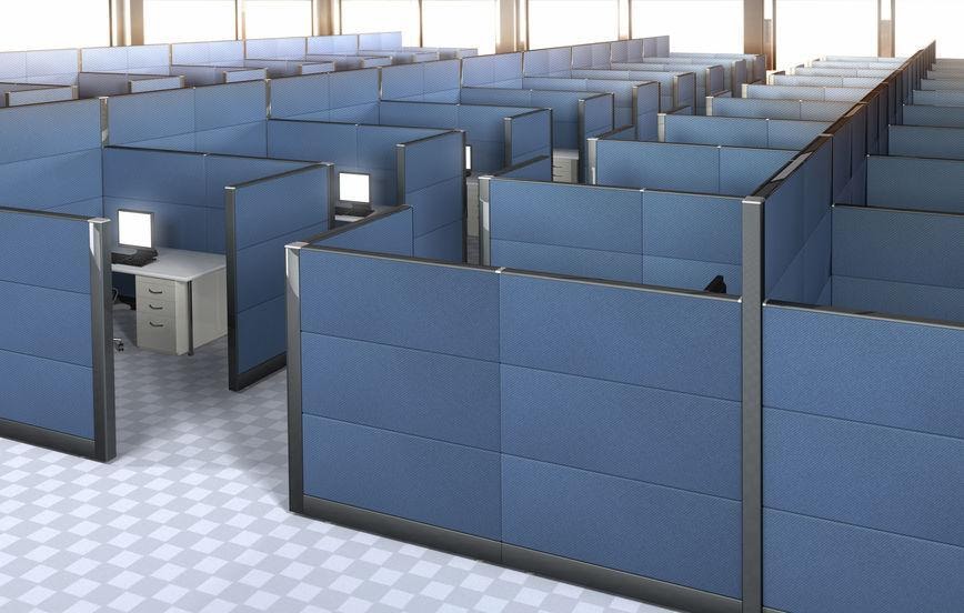A top, long view of blue, equal-size and tightly assembled office cubicles.