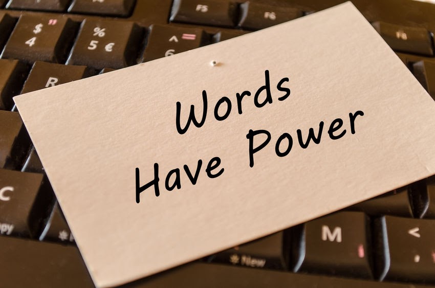 Card on a keyboard that reads, Words Have Power