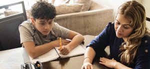 Parent and student are sitting at a table